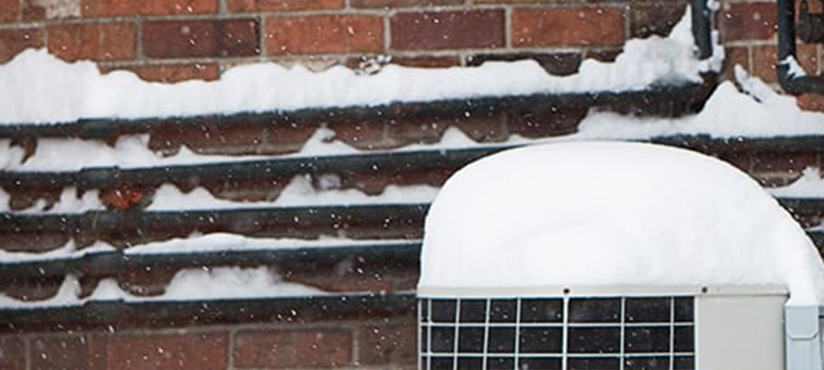 Frozen pipes on side of a house